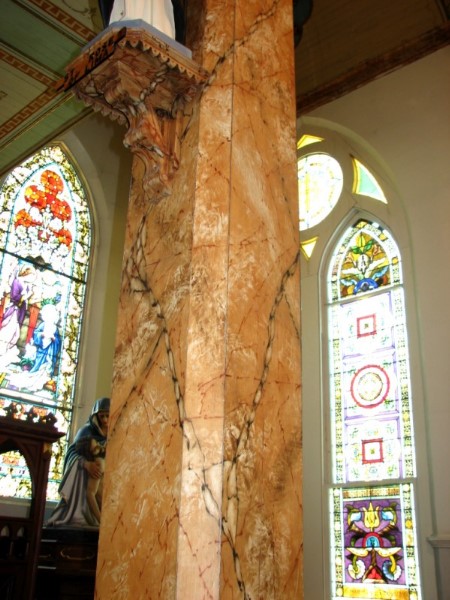 Wooden columns painted to resemble marble